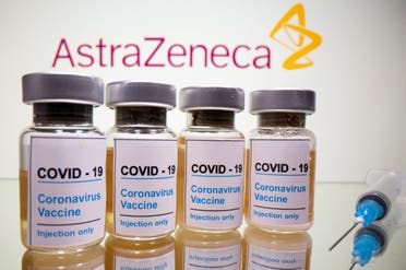 Vials with a sticker reading, COVID-19 / Coronavirus vaccine / Injection only and a medical syringe are seen in front of a displayed AstraZeneca logo in this illustration taken October 31, 2020. (Reuters)