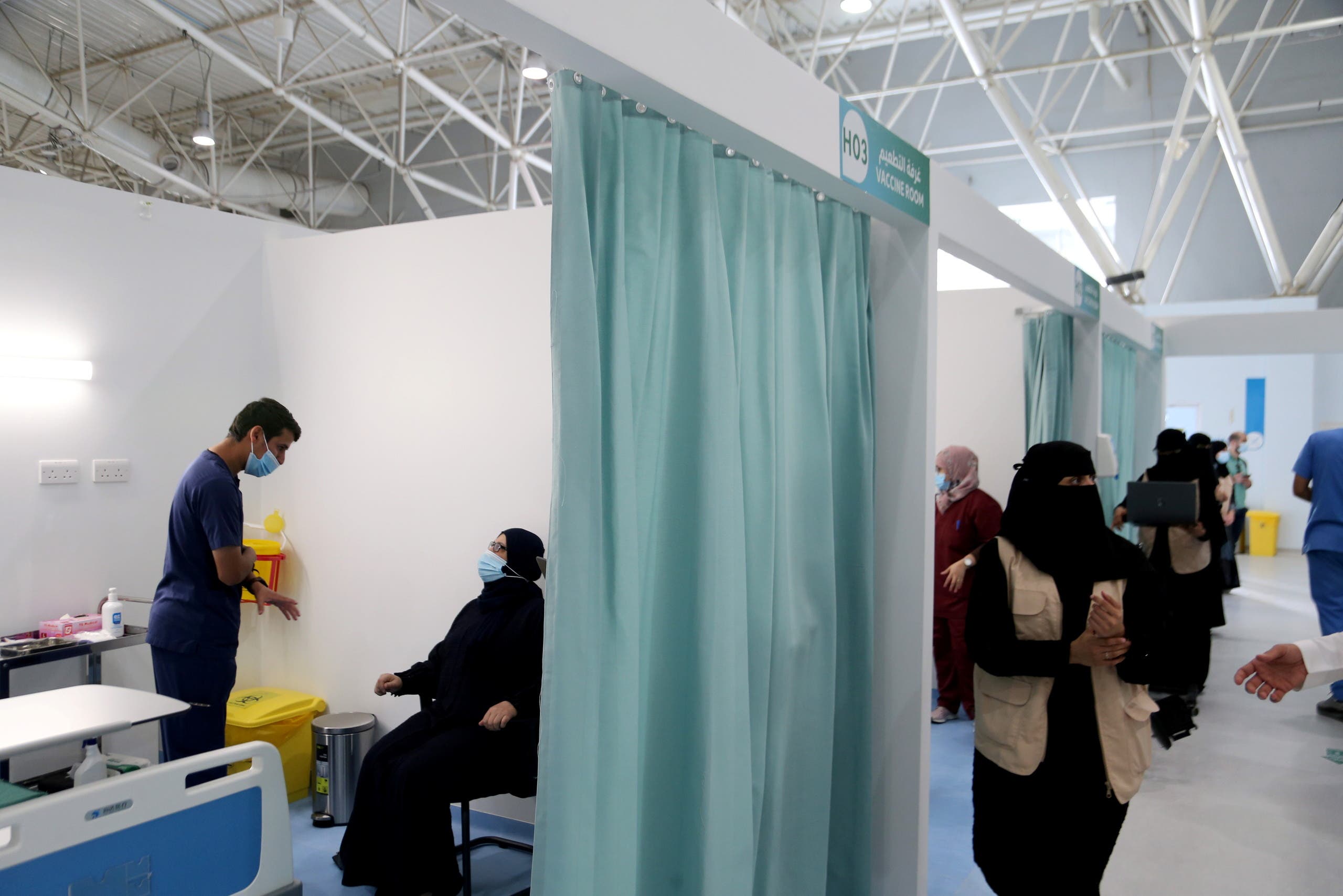 A Saudi woman waits to get a dose of a coronavirus disease (COVID-19) vaccine, in Riyadh. (Reuters)