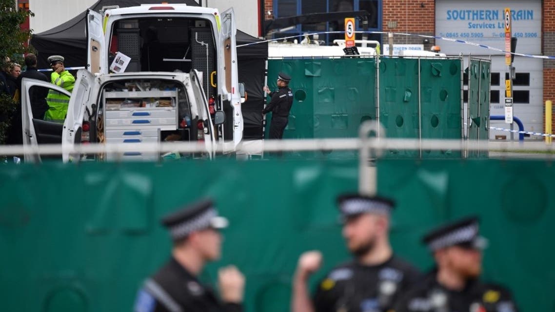 In this file photo taken on October 23, 2019 British Police officers work near a lorry found to be containing 39 dead bodies, inside a police cordon at Waterglade Industrial Park in Grays, east of London, on October 23, 2019. (Ben Stansall/AFP)