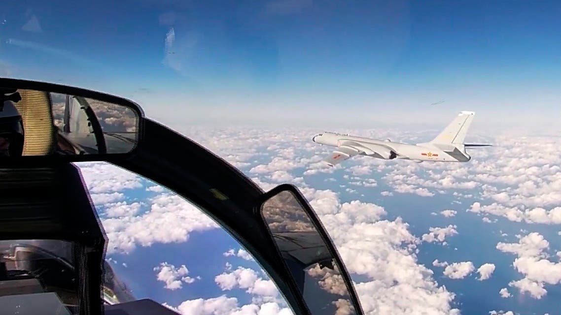 In this photo taken from a video distributed by Russian Defense Ministry Press Service, on December 22, 2020, a Chinese H-6K strategic bomber flies during a joint patrol mission over the Western Pacific. (AP)