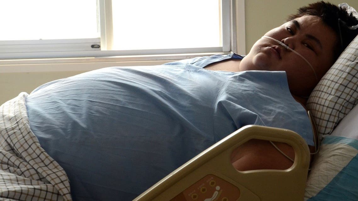 Sun Liang, 22 year-old, weighing more than 300 kg currently, has been unable to walk since early this year and entered hospital for treatment after suffering from physical disfunctions caused by obesity in April, local media reported. (AFP)