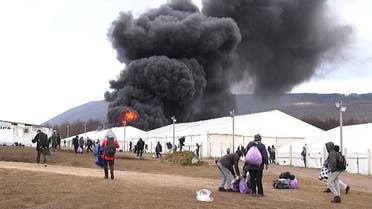 Migrant camp “Lipa” is seen under fire in Bihac, Bosnia and Herzegovina December 23, 2020. (Reuters)