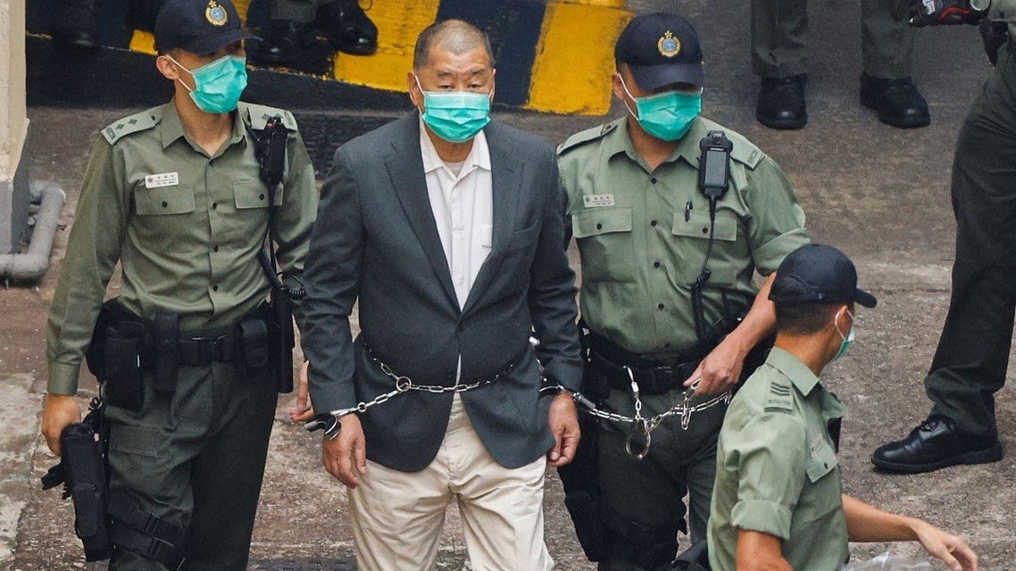 Media mogul Jimmy Lai Chee-ying, founder of Apple Daily, walks to a prison van to head to court, after being charged under the national security law, in Hong Kong, China, on December 12, 2020. (Reuters)