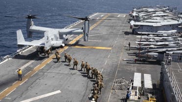 Handout file photo courtesy of US Navy, Marines load into a V-22 Osprey on the flight deck of the USS Makin Island (LHD8) as they conduct maritime operations off the coast of Somalia in support of Operation Octave Quartz (OOQ) on December 22, 2020. (AFP)