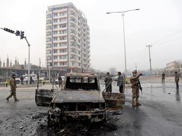 Afghan security forces inspect at the site of a blast in Kabul, Afghanistan, on December 20, 2020. (Reuters)