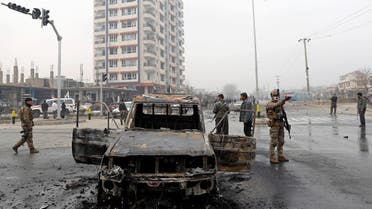 Afghan security forces inspect at the site of a blast in Kabul, Afghanistan, on December 20, 2020. (Reuters)
