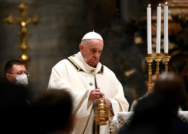 Pope Francis leads the Mass on Christmas Eve in St. Peter's Basilica amid the coronavirus pandemic at the Vatican, on December 24, 2020.  (Reuters)