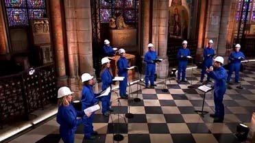 With choir in hard hats, fire-ravaged Notre-Dame rings in Christmas. (Screengrab)