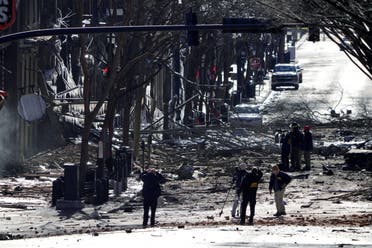 Investigators work near the site of an explosion on 2nd Avenue that occurred the day before in Nashville, Tennessee, US December 26, 2020. (Reuters)