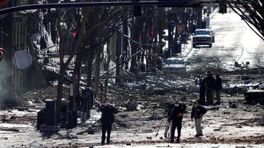 Investigators work near the site of an explosion on 2nd Avenue that occurred the day before in Nashville, Tennessee, U.S. December 26, 2020. (Reuters)