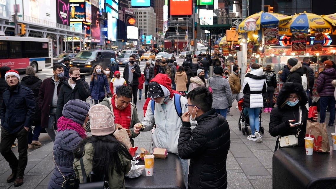 Pedestrians enjoy Times Square in New York on Christmas day, Friday, Dec. 25, 2020. (AP/Seth Wenig)