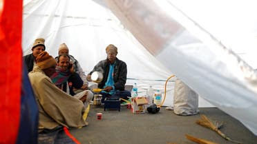 Farmers make tea inside a tent at the site of a protest against new farm laws, at a state border on a national highway in Shahjahanpur, in the desert state of Rajasthan, near New Delhi, India, on December 26, 2020. (Reuters)