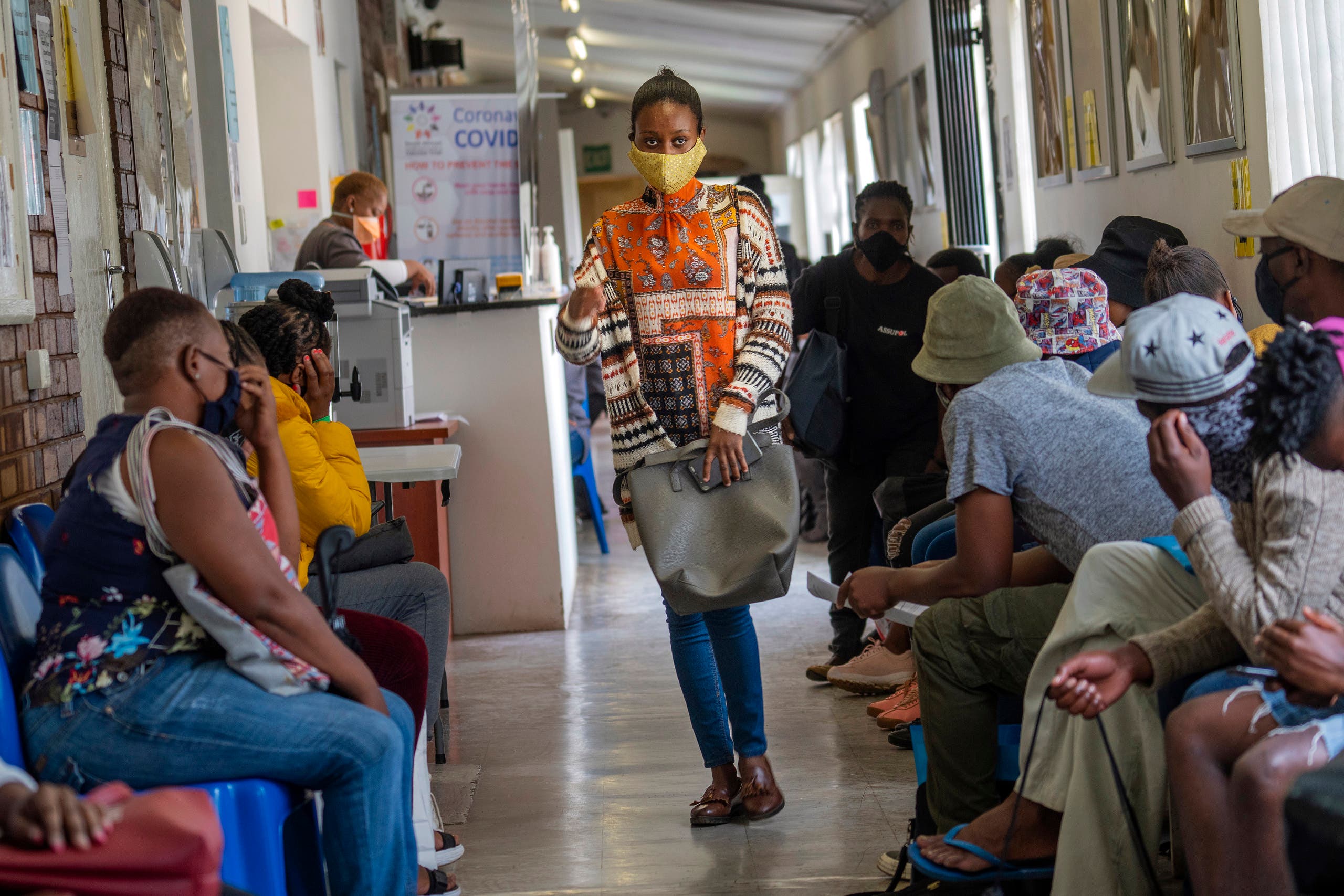  Volunteers wait to be checked at a vaccine trial facility set at Soweto's Chris Sani Baragwanath Hospital outside Johannesburg, South Africa, Monday November 30, 2020. (AP Photo)