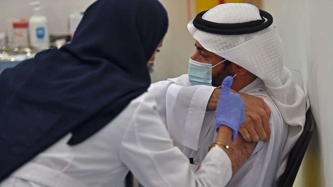 This picture taken on December 17, 2020 shows Saudi Arabia's Health Minister Tawfiq al-Rabiah waiting to receive the Pfizer-BioNTech COVID-19 coronavirus vaccine. (AFP)