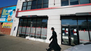 An Orthodox Jewish man walks past the exterior of Parcare’s health care facility Sunday, Dec. 27, 2020, in the Willamsburg section of Brooklyn in New York. (AP/Kathy Willens)