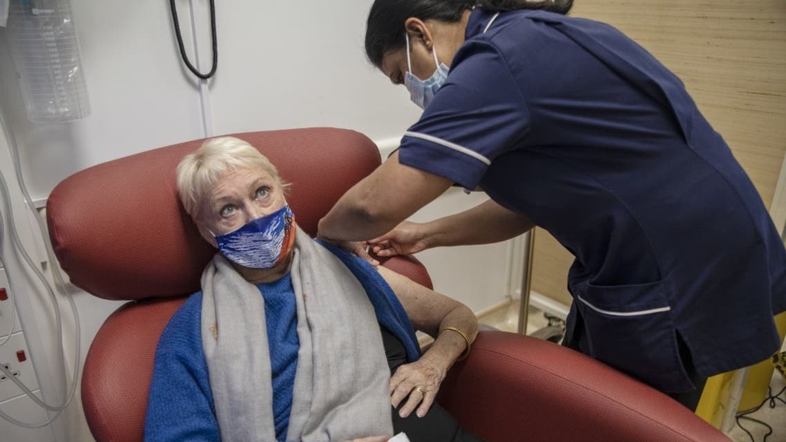 Nurse administers an injection of the Pfizer-BioNTech Covid-19 vaccine, at the Royal Free hospital in London on December 8, 2020. (AFP)