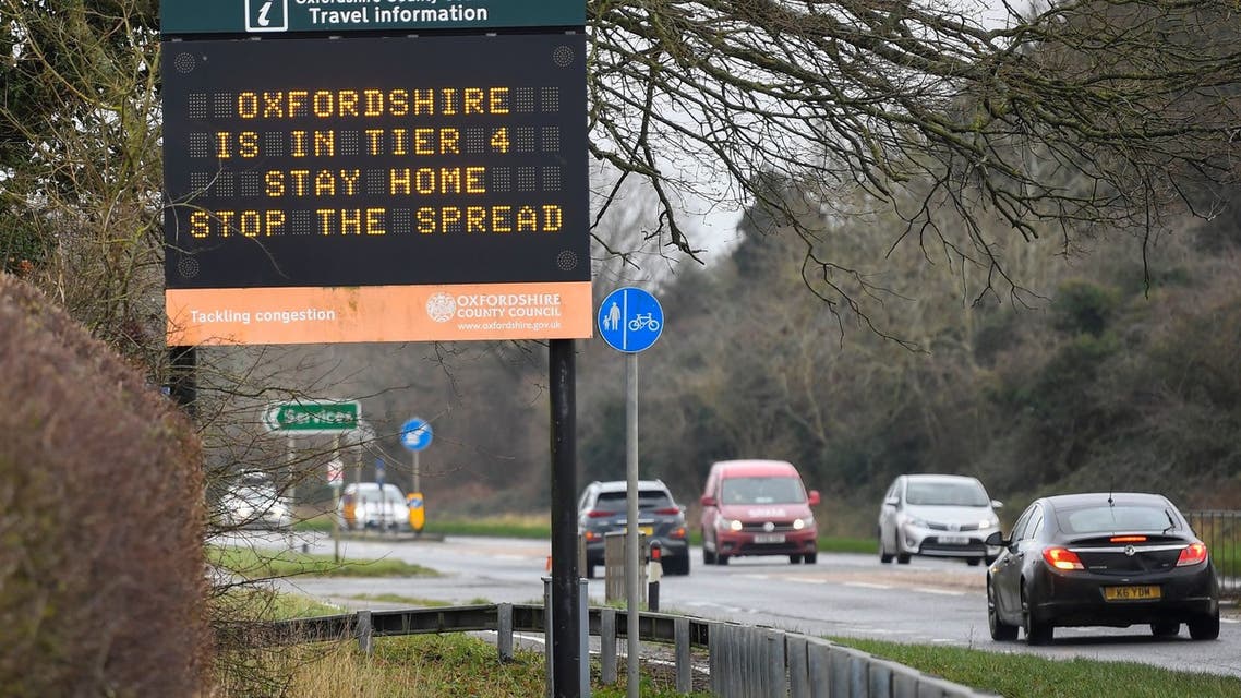 Vehicles drive past a roadside public health information sign, amidst the spread of the coronavirus disease (COVID-19) pandemic, near Oxford, Britain, December 28, 2020. REUTERS/Toby Melville