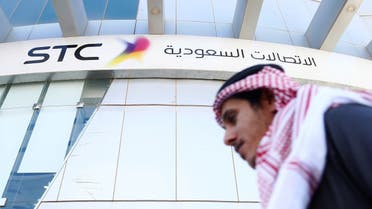 A man passes the Saudi Telecom STC office in Riyadh. (Reuters)