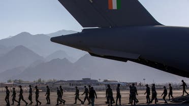 Indian soldiers disembark from a military transport plane at a forward airbase in Leh, in the Ladakh region, on Septem