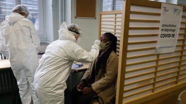 A student of the Emile Dubois Lycee takes part in antigen testing for the novel coronavirus, Covid-19, in Paris on November 23, 2020. (AFP)