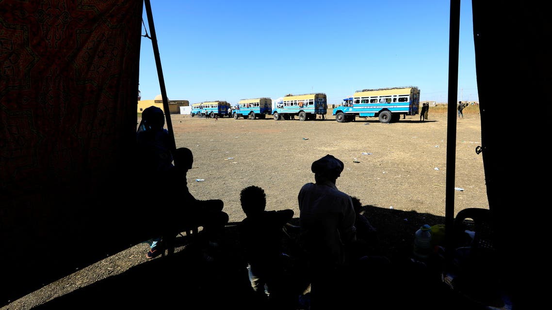 Ethiopian refugees who fled Tigray region, wait to board courtesy buses at the Fashaga camp as they are transferred to Um-Rakoba camp on the Sudan-Ethiopia border, in Kassala state, Sudan December 13, 2020. (Reuters)