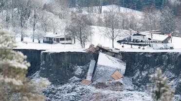 Police helicopter works after yesterday's landslide in Ask, Gjerdrum municipality, Norway, on December 31, 2020. (Reuters)