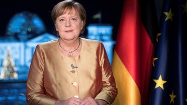 German Chancellor Angela Merkel poses for photographs after the television recording of her annual New Year’s speech, Dec. 30, 2020. (Reuters)