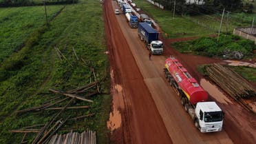 Parked trucks wait in a 10km queue, to cross the Kenyan-Ugandan border from the town of Busia, Kenya November 14, 2020. Picture taken November 14, 2020. (Reuters)