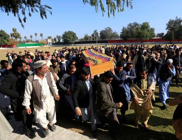 Afghan men carry the coffin of journalist Malalai Maiwand, who was shot and killed by unknown gunmen in Jalalabad, Afghanistan, on December 10, 2020. (Reuters)
