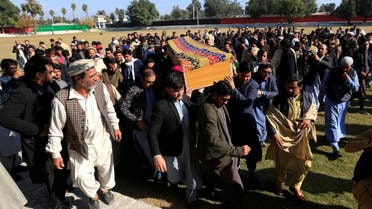 Afghan men carry the coffin of journalist Malalai Maiwand, who was shot and killed by unknown gunmen in Jalalabad, Afghanistan, on December 10, 2020. (Reuters)