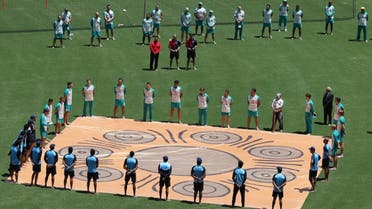 The Australian and Indian Teams line up during a ceremony honoring Indigenous Australians before the first One Day International match at the  Sidney Cricket Ground, Sidney, Australia , on November 27, 2020. (Reuters)