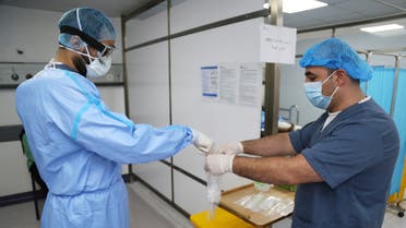 A doctor, wearing protective gear, handles a test for the coronavirus disease (COVID-19), at Rafik Hariri University Hospital, in Beirut. (File photo: Reuters)
