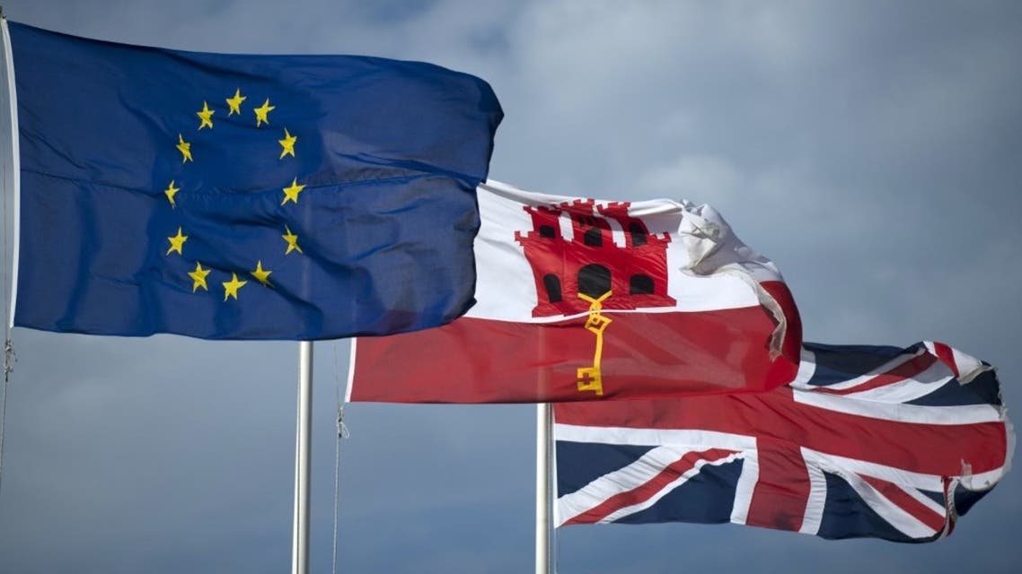 In this file photo taken on January 31, 2020 the EU flag flies next to Gibraltar's flag (C) and the Union Jack (R) in Gibraltar. (AFP)