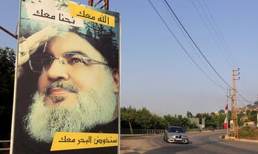 A car drives past a poster depicting Lebanon's Hezbollah leader Sayyed Hassan Nasrallah in Adaisseh village, near the Lebanese-Israeli border, Lebanon. (File photo: Reuters)