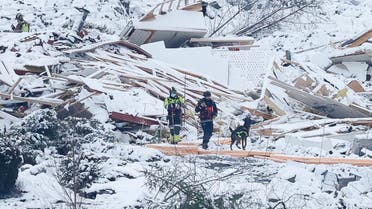 Rescue workers with a dog search the area on January 2, 2021 following the landslide that hit a residential area in Ask in Gjerdrum during Christmas. (Erik Schroeder/NTB/AFP)