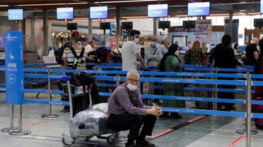 A man sits next to a check-in counter at Sabiha Gokcen Airport in Istanbul. (File photo: Reuters)