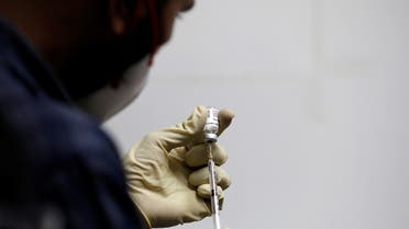 A medic fills a syringe with COVAXIN before administering it to a health worker during its trials, at the Gujarat Medical Education and Research Society in Ahmedabad, India, November 26, 2020. (Reuters/Amit Dave)