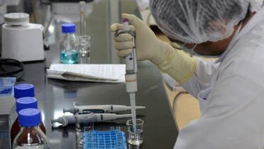 A research scientist works inside a laboratory in India. 