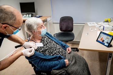 Jytte Margrete Frederiksen, 83, receives the Pfizer-BioNTech coronavirus disease (COVID-19) vaccine, in Ishoj, Denmark December 27, 2020. (Ritzau Scanpix/Mads Claus Rasmussen via Reuters)