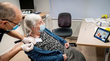Jytte Margrete Frederiksen, 83, receives the Pfizer-BioNTech coronavirus disease (COVID-19) vaccine, in Ishoj, Denmark December 27, 2020. (Reuters)