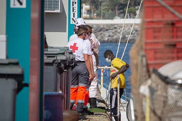 A file photo shows a migrant arrives at the Port of Arguineguin after being rescued by the Spanish coastguard in the Canary Island on November 23, 2020. (AFP)