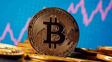 202 A representation of virtual currency bitcoin is seen in front of a stock graph. (Reuters)1-01-05T150310Z_868199197_RC2R1L9MOVLJ_RTRMADP_3_CRYPTO-CURRENCIES-FLOWS
