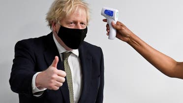 Britain's Prime Minister Boris Johnson visits the Chase Farm Hospital in north London. (Reuters)