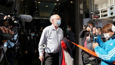 American lawyer John Clancey walks out of a building as he is taken away by police officers in Hong Kong, China, on January 6, 2021. (Reuters)