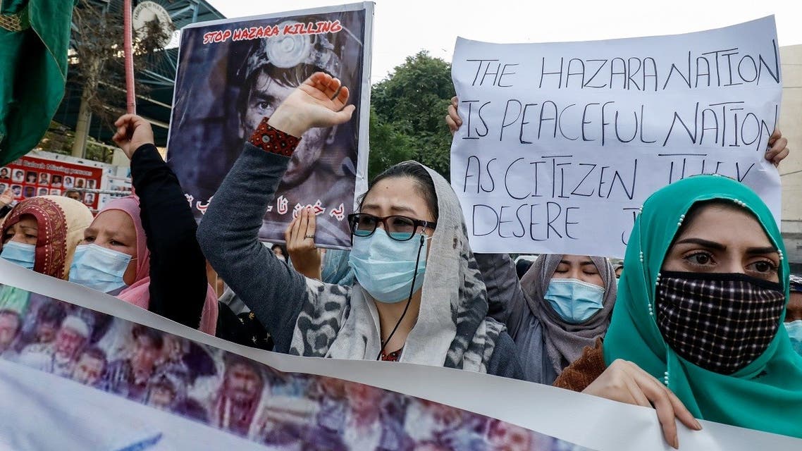 People chant slogans as they carry placards demanding justice, following the killings of coal miners from Pakistan's minority Shi'ite Hazara community in an attack in Mach area of Bolan district, during a protest in Karachi, Pakistan, on January 5, 2021. (Reuters)