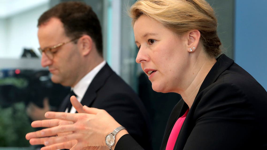 German Minister for Family Affairs, Senior Citizens, Women and Youth, Franziska Giffey, right, speaks during a joint press conference with German Health Minister Jens Spahn, left, in Berlin, Germany, Friday, Oct. 16, 2020. (AP Photo/Michael Sohn, pool)