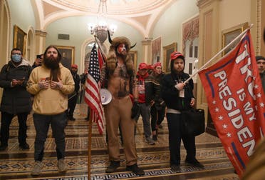Supporters of US President Donald Trump including Jacob Chansley (center) enter the US Capitol on January 6, 2021, in Washington, DC. Demonstrators breeched security and entered the Capitol. (AFP)
