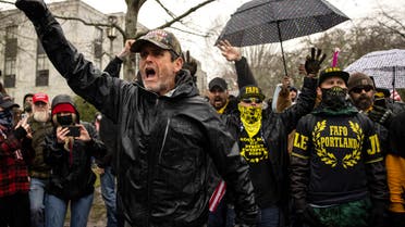 Protesters confront riot police as they gathered at the Capitol on Wednesday, Jan. 6, 2021 in Salem, Ore. Thousands of President Donald Trump's supporters caused violence and chaos in Washington while Congress attempted to vote to certify that President-elect Joe Biden won the election. (AP Photo/Paula Bronstein)