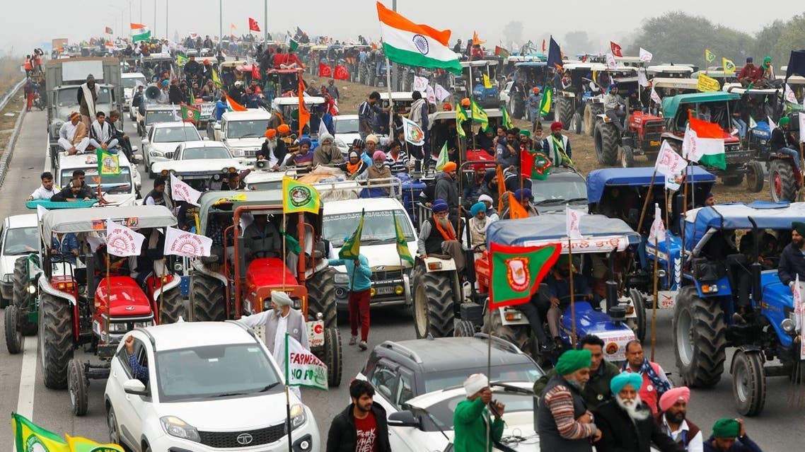 Farmers participate in a tractor rally to protest against the newly passed farm bills, on a highway on the outskirts of New Delhi, India, on January 7, 2021. (Reuters)