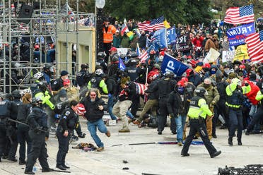 Trump supporters clash with police and security forces as they storm the US Capitol in Washington, DC on January 6, 2021. (AFP)